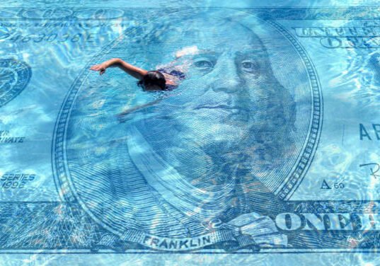 conceptual one person swimming on clear blue water covered with American one hundred dollar